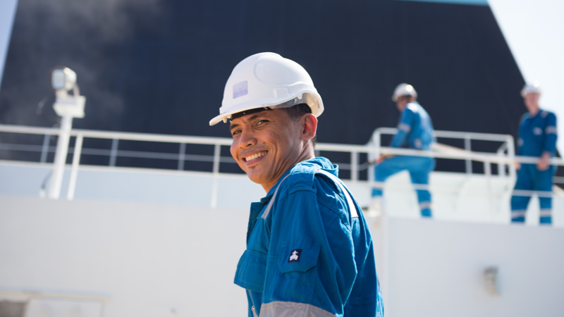 seafarer turns and smiles