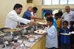 Children enjoying a feast after the session